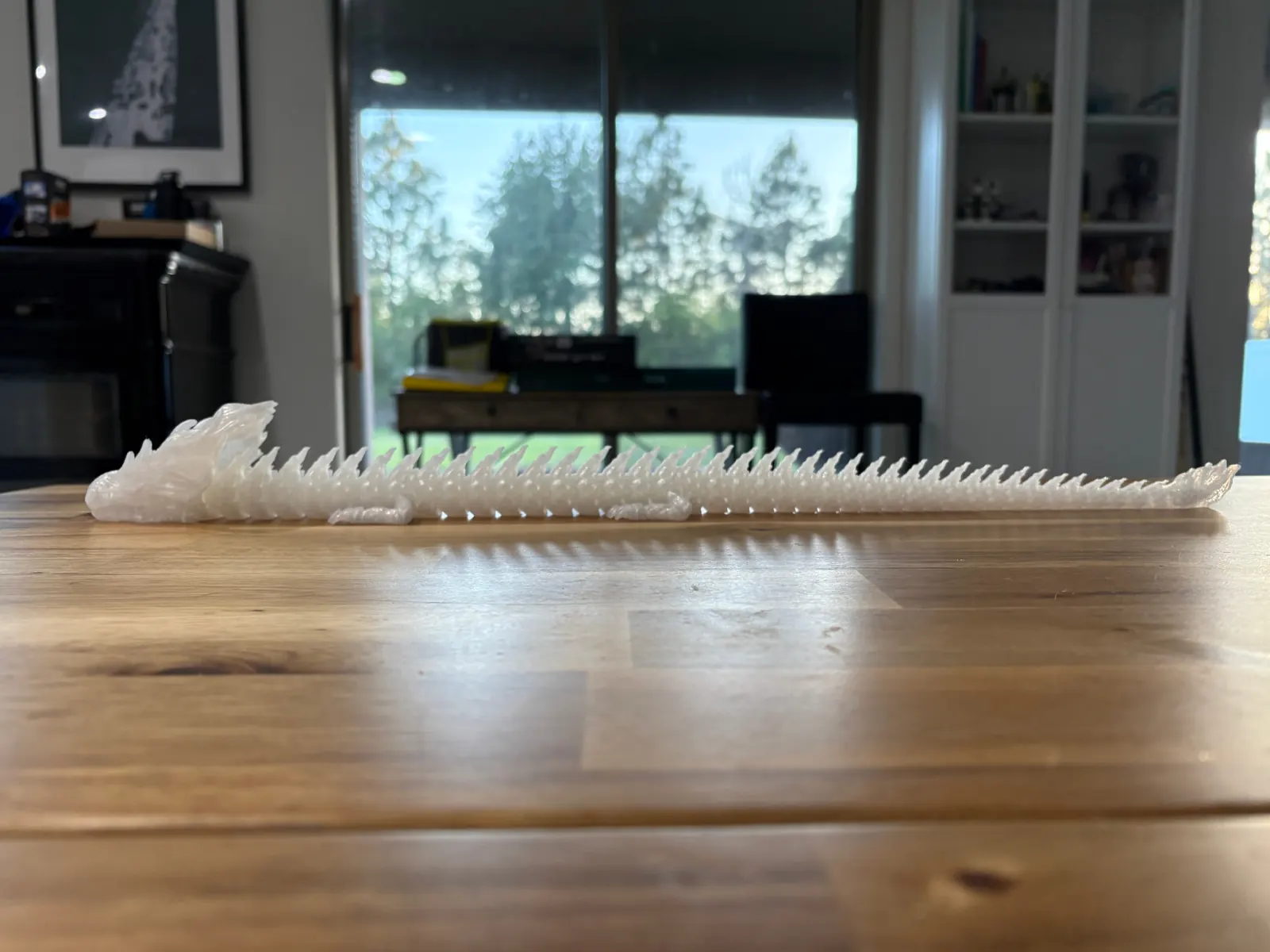 Profile view of an articulated dragon print